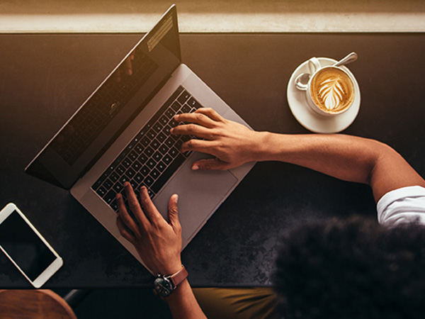 professional digital workspace with laptop and mobile phone on office desk"