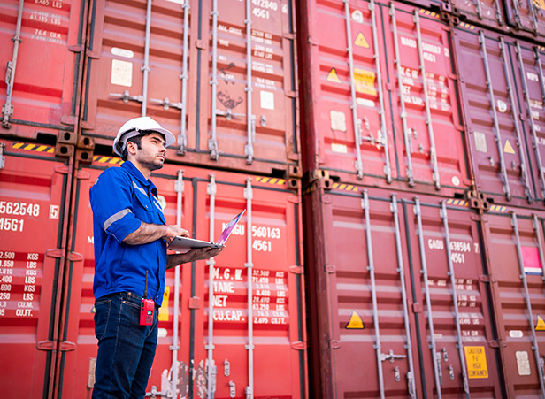 Man evaluating containers
