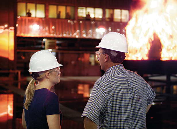 Two People Talking In Front Of A Fire Demonstration
