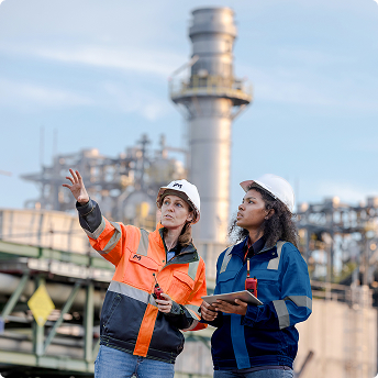 Engineers inspect industrial pipes